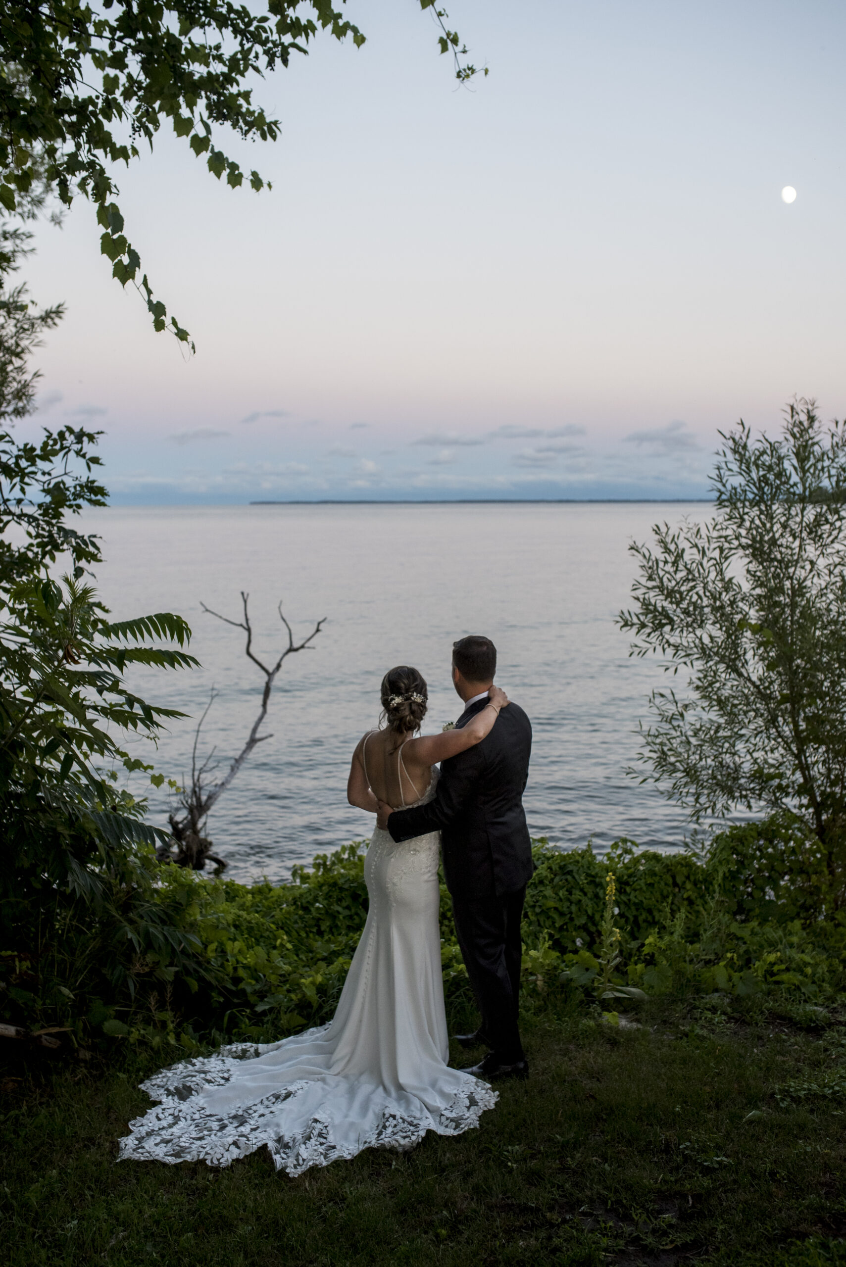 Bride and Groom look at moon at their Waupoos Winery wedding