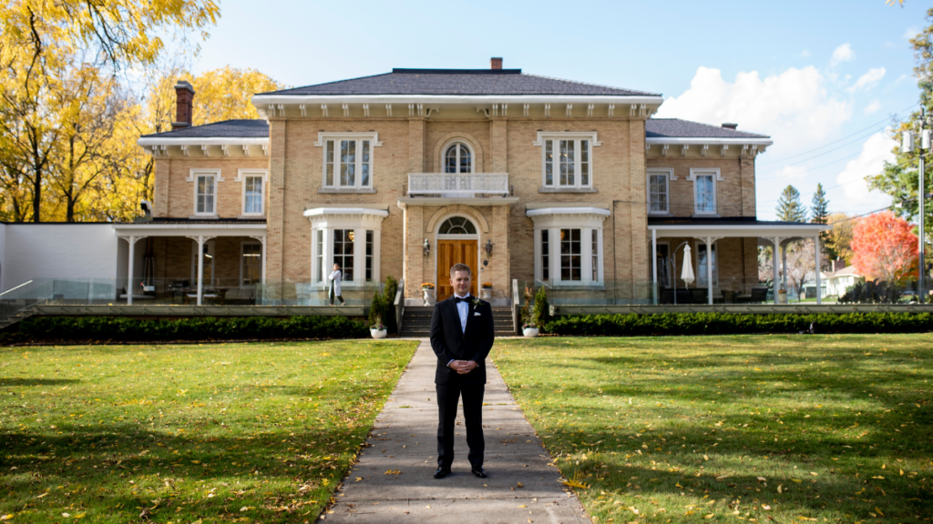 Groom standing in front of the CAPE Picton